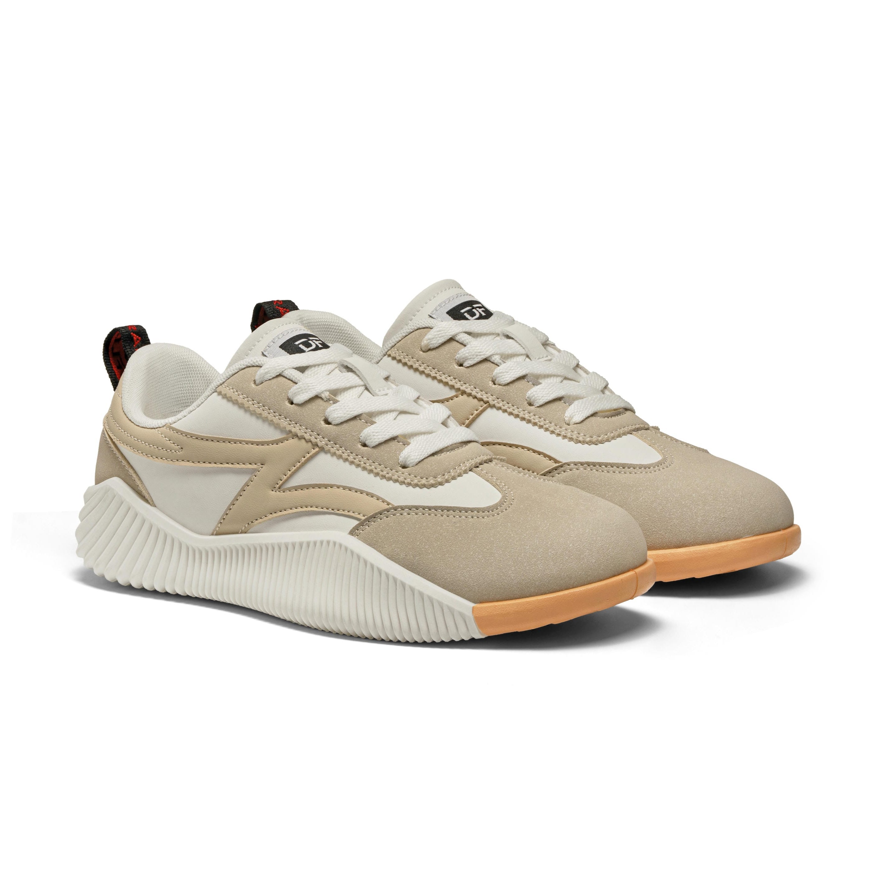 Beige and white sneakers with tan soles on a white background